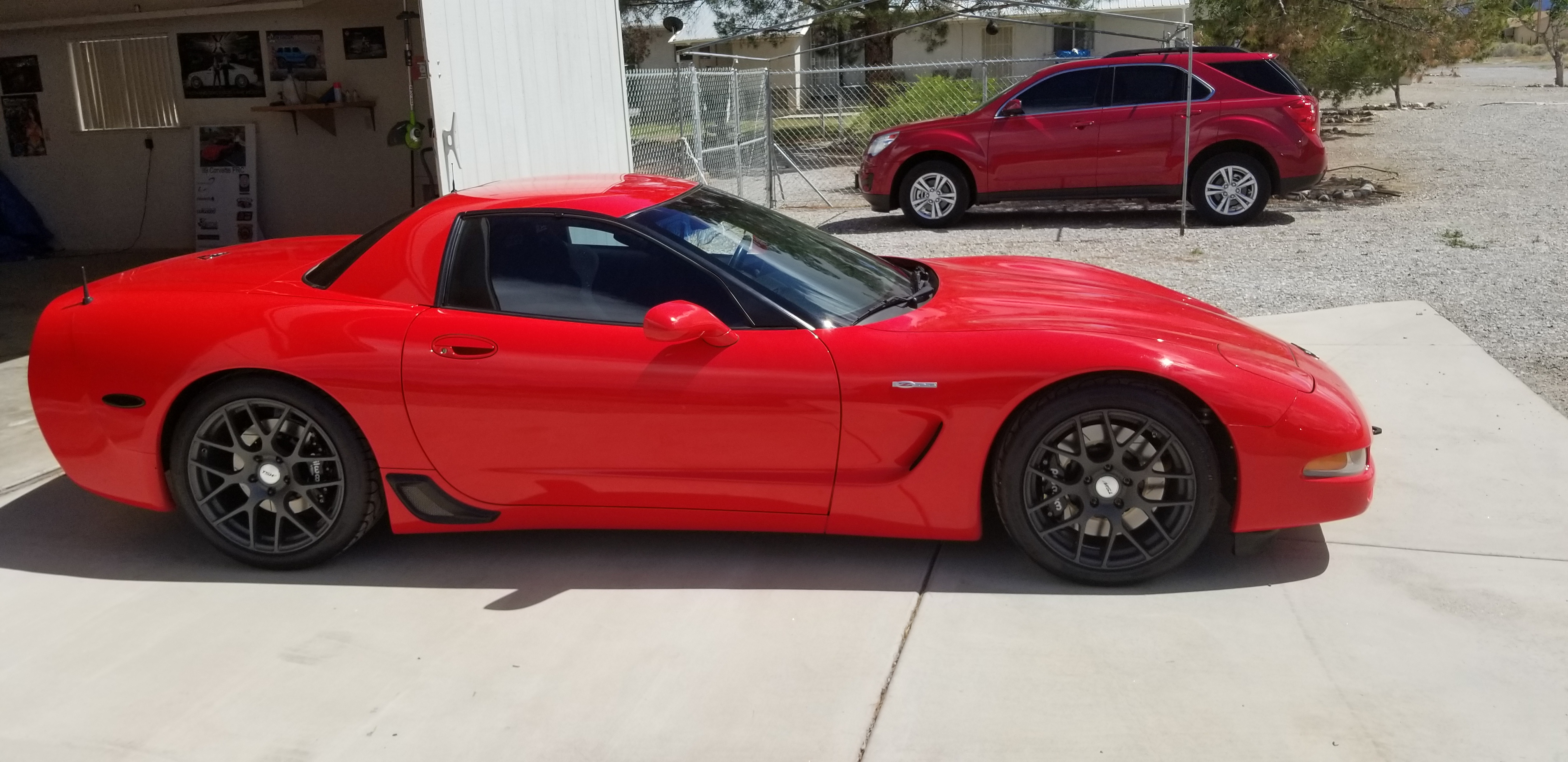 A red sports car parked in a driveway

Description automatically generated with medium confidence